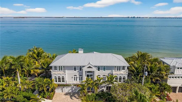 a aerial view of a house with a ocean view