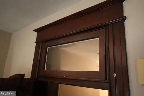 a view of a livingroom with furniture and a window