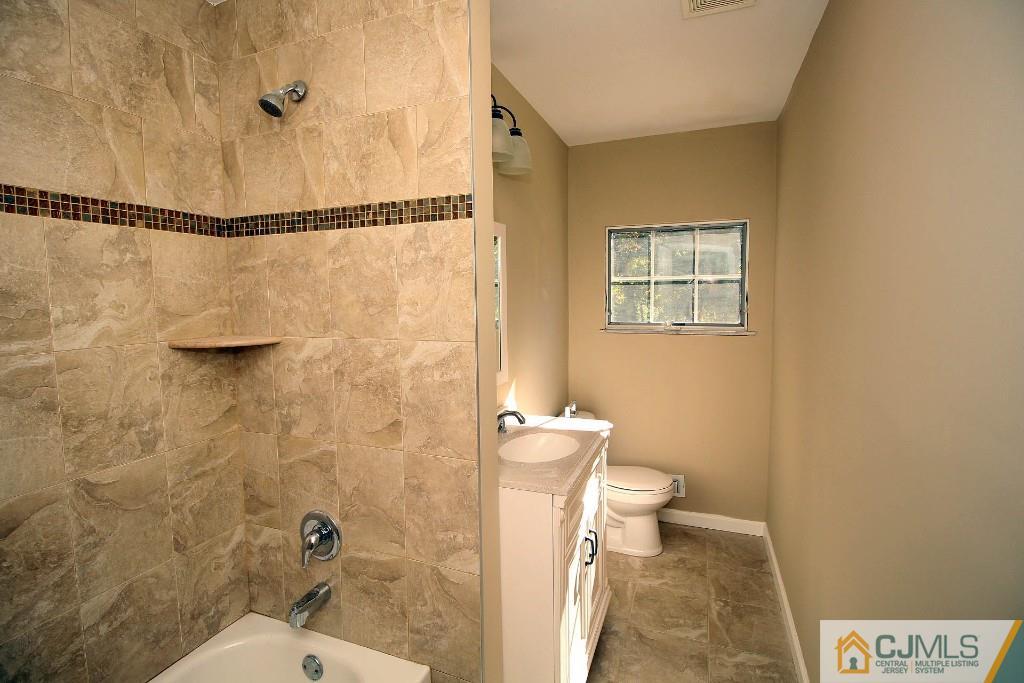 17 Brookside Road Edison, NJ 08817 - Photo 17 of 20 a bathroom with a toilet and shower