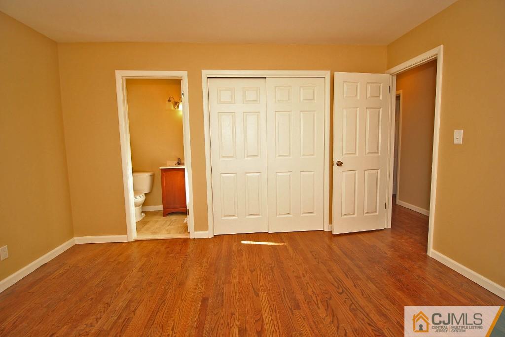 17 Brookside Road Edison, NJ 08817 - Photo 20 of 20 an empty room with wooden floor and closet area