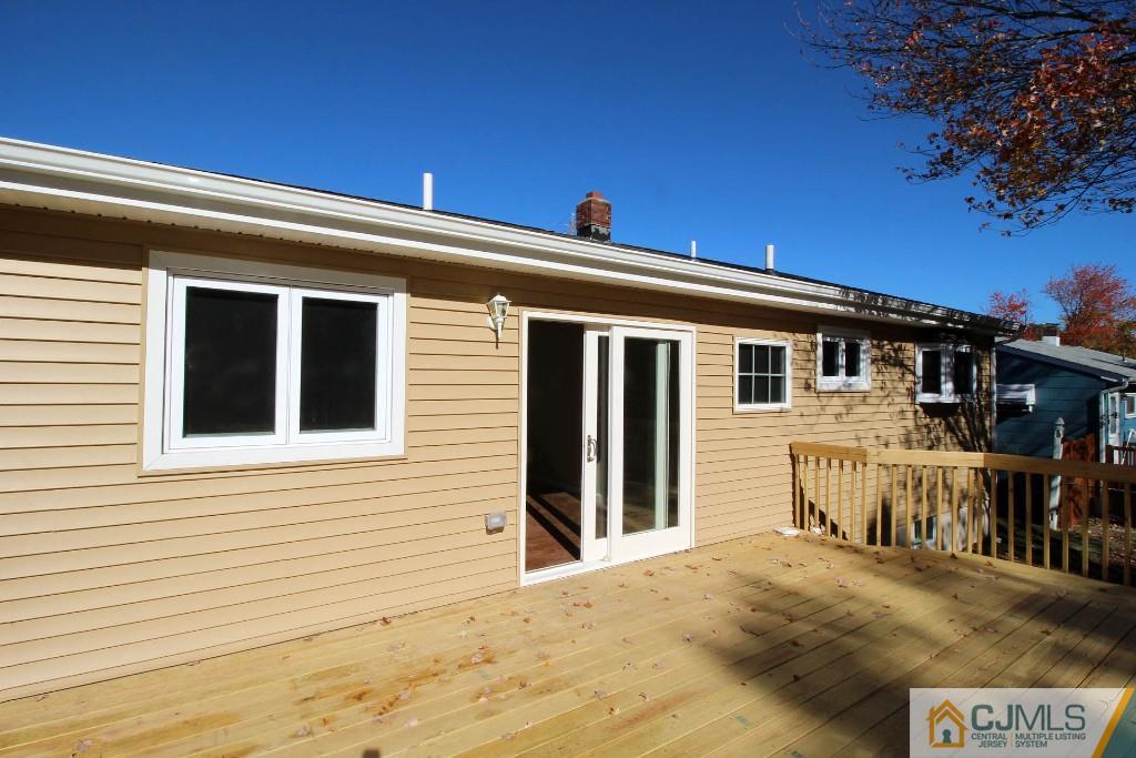 17 Brookside Road Edison, NJ 08817 - Photo 3 of 20 a front view of a house with a outdoor space