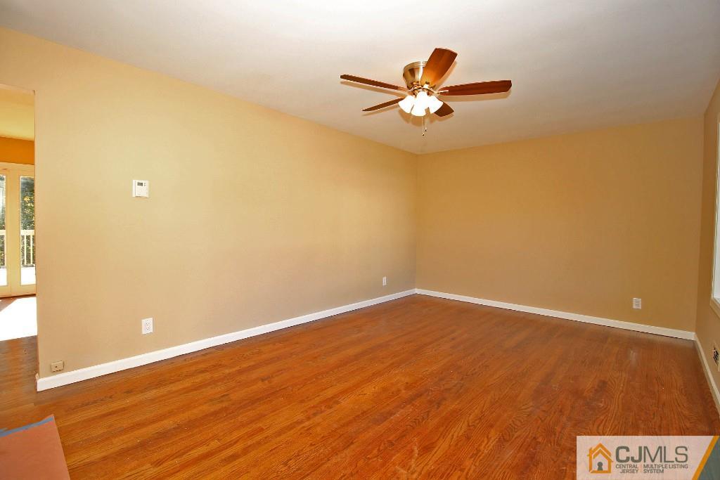 17 Brookside Road Edison, NJ 08817 - Photo 4 of 20 a view of empty room with wooden floor