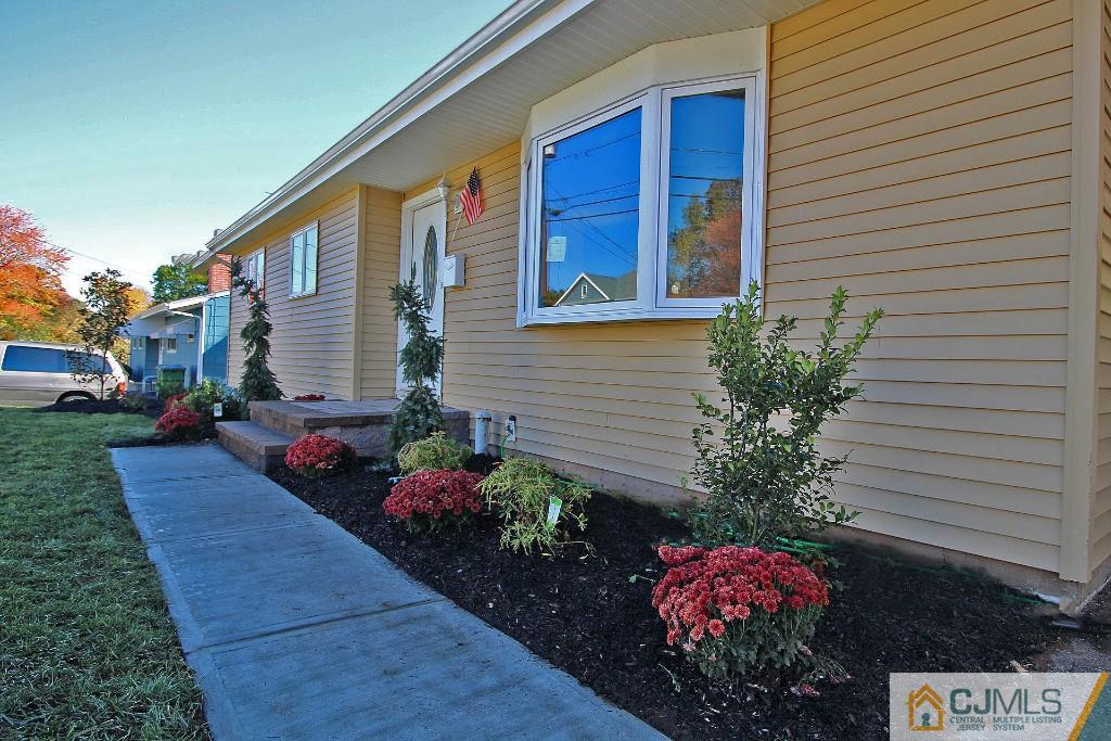 17 Brookside Road Edison, NJ 08817 - Photo 7 of 20 a front view of a house with a yard