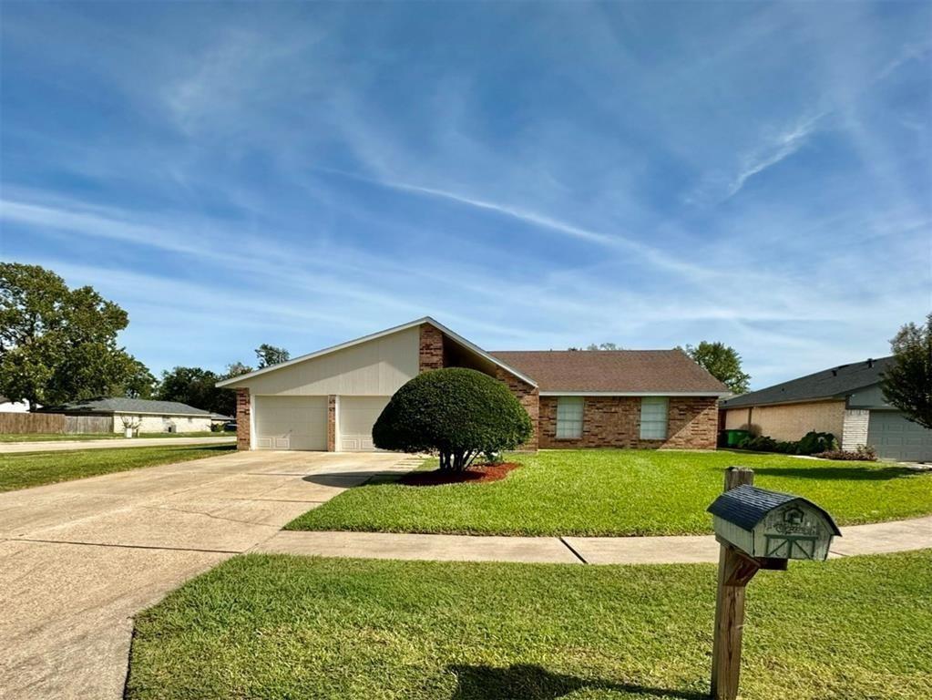 23810 Hunter Spring Circle Spring, TX 77373 - Photo 1 of 17 a front view of a house with garden