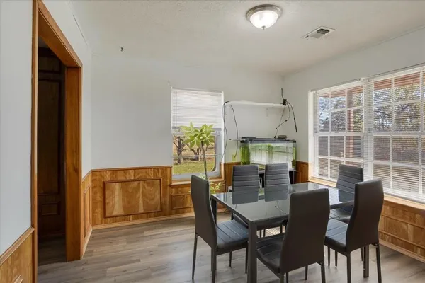 a kitchen with stainless steel appliances a refrigerator and a stove