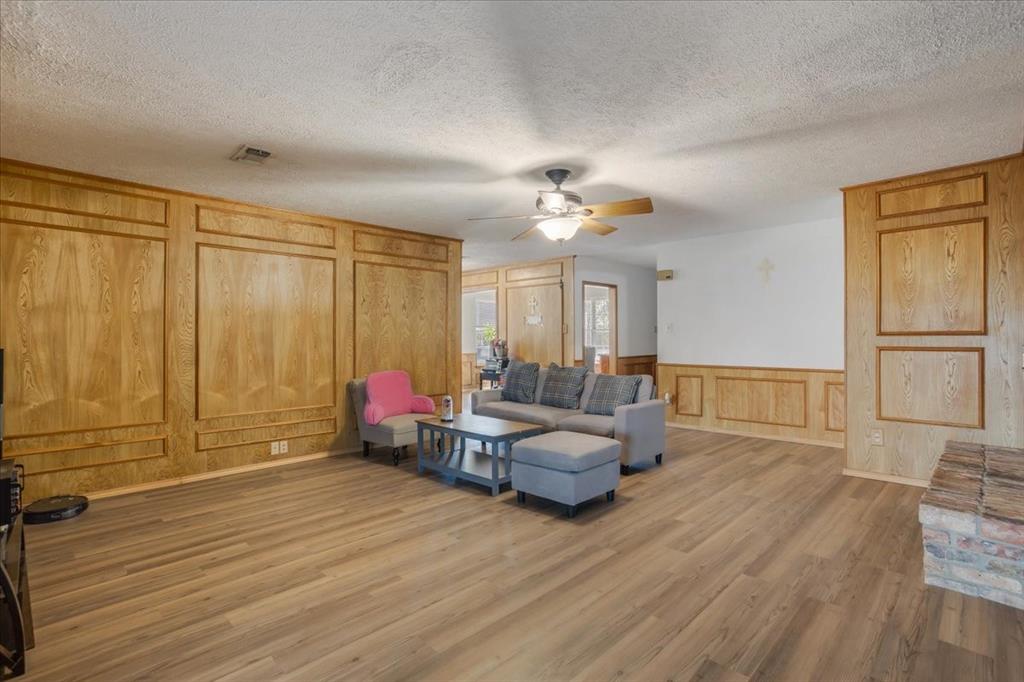 567 Celtic Road Howe, TX 75459 - Photo 16 of 40 a living room with furniture and a wooden floor