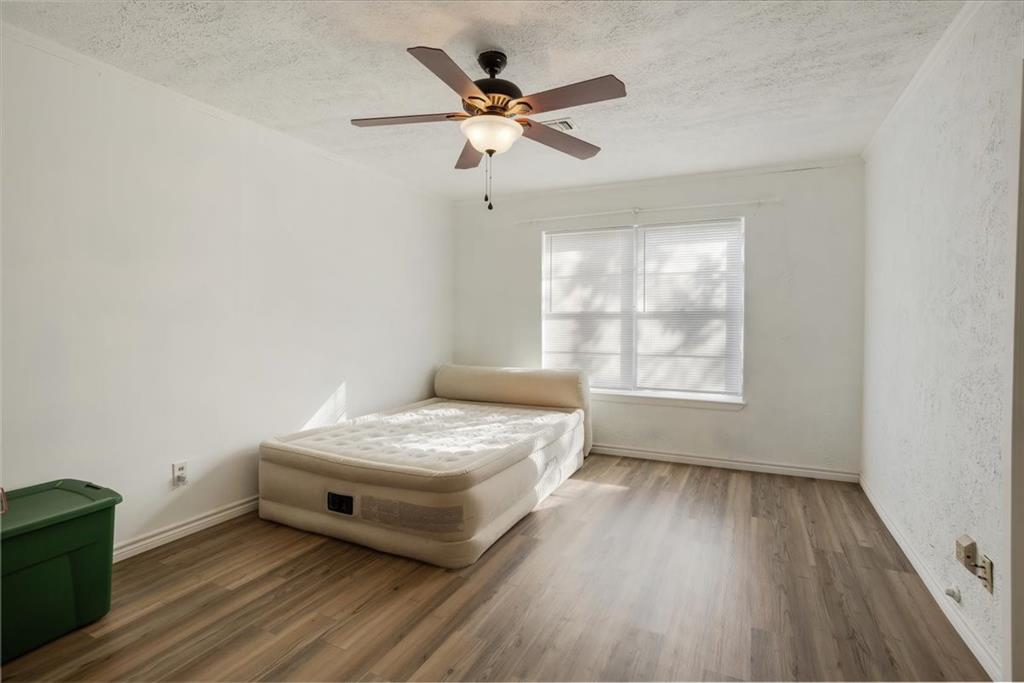 567 Celtic Road Howe, TX 75459 - Photo 19 of 40 a bedroom with a bed and window