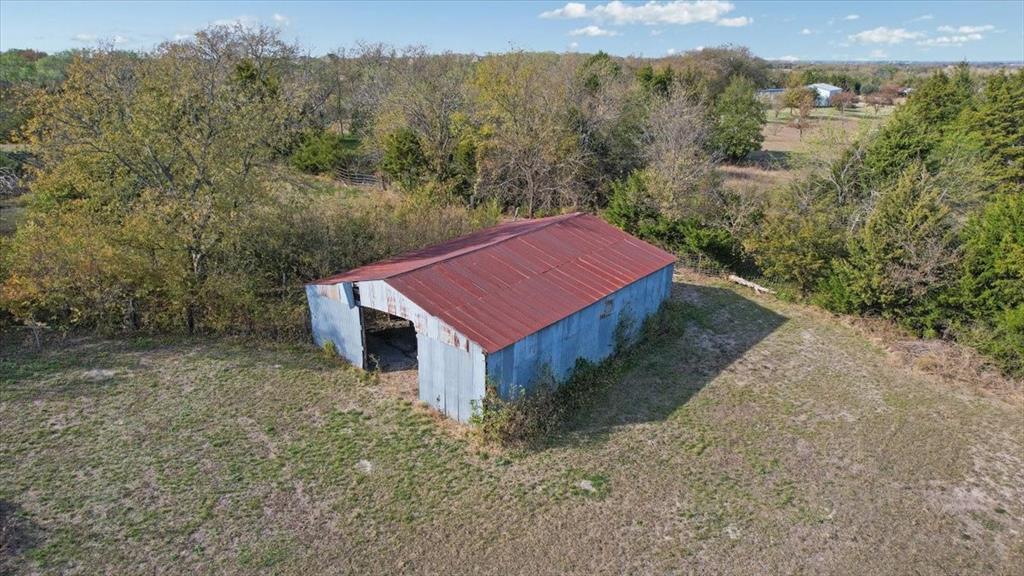 567 Celtic Road Howe, TX 75459 - Photo 2 of 40 a view of a barn with a yard