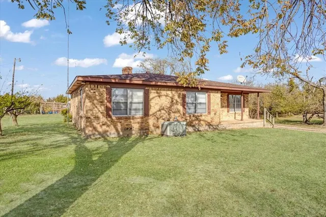 a view of a house with a big yard
