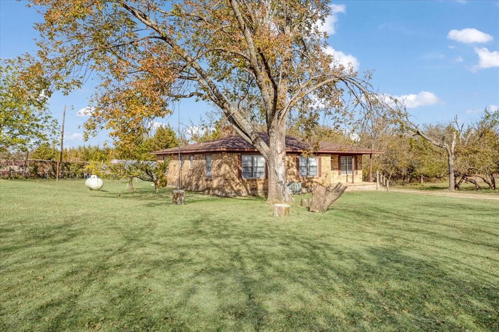 567 Celtic Road Howe, TX 75459 - Photo 9 of 40 a view of a yard with a house in the background