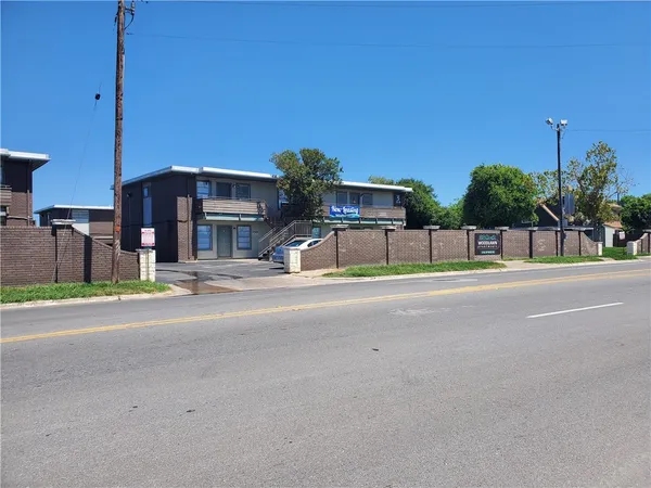 a view of a house with a street