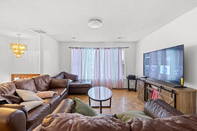 a kitchen with cabinets appliances a sink and a window