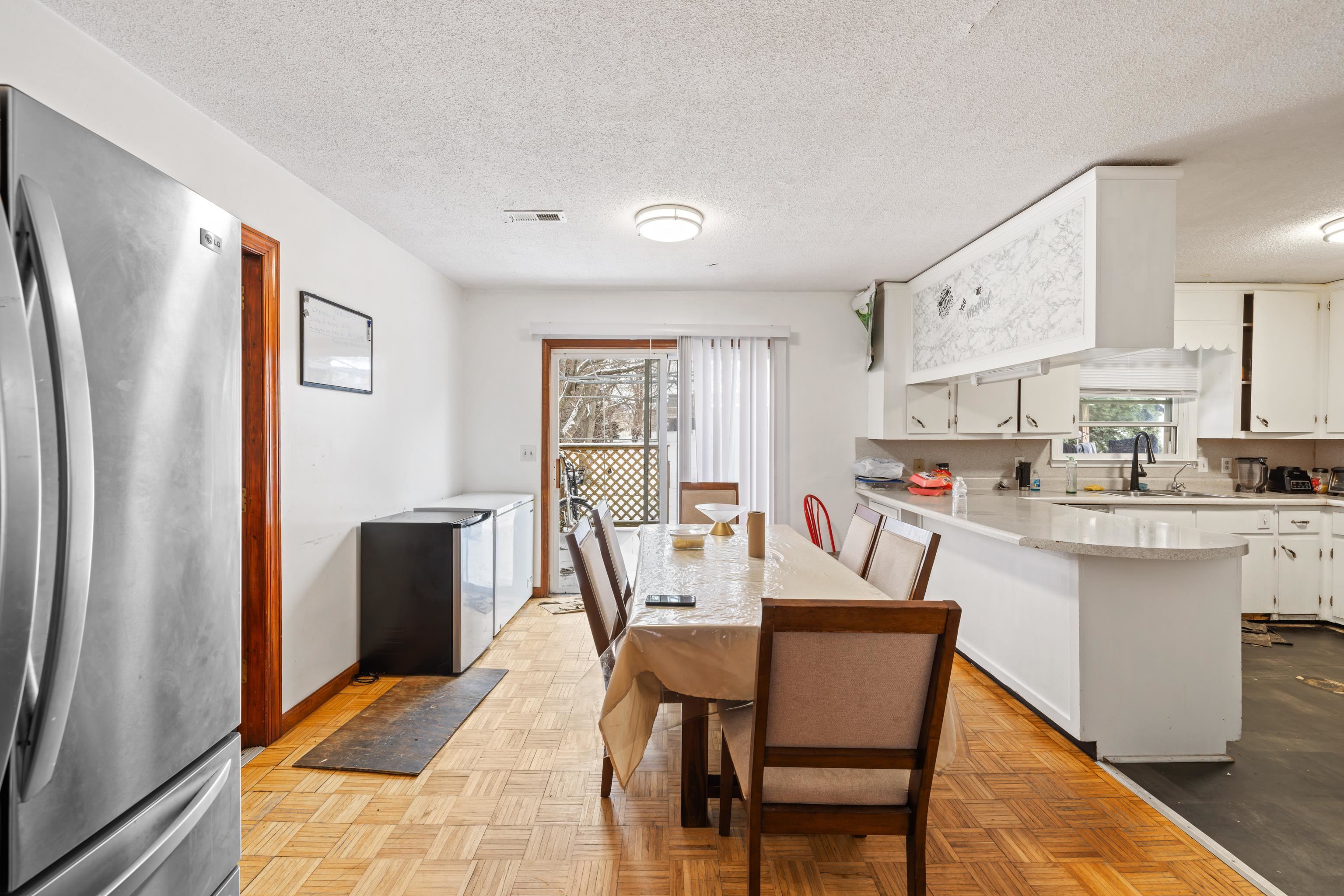 728 Foley Road Harrisonburg, VA 22801 - Photo 13 of 62 a dining room with stainless steel appliances a dining table and chairs