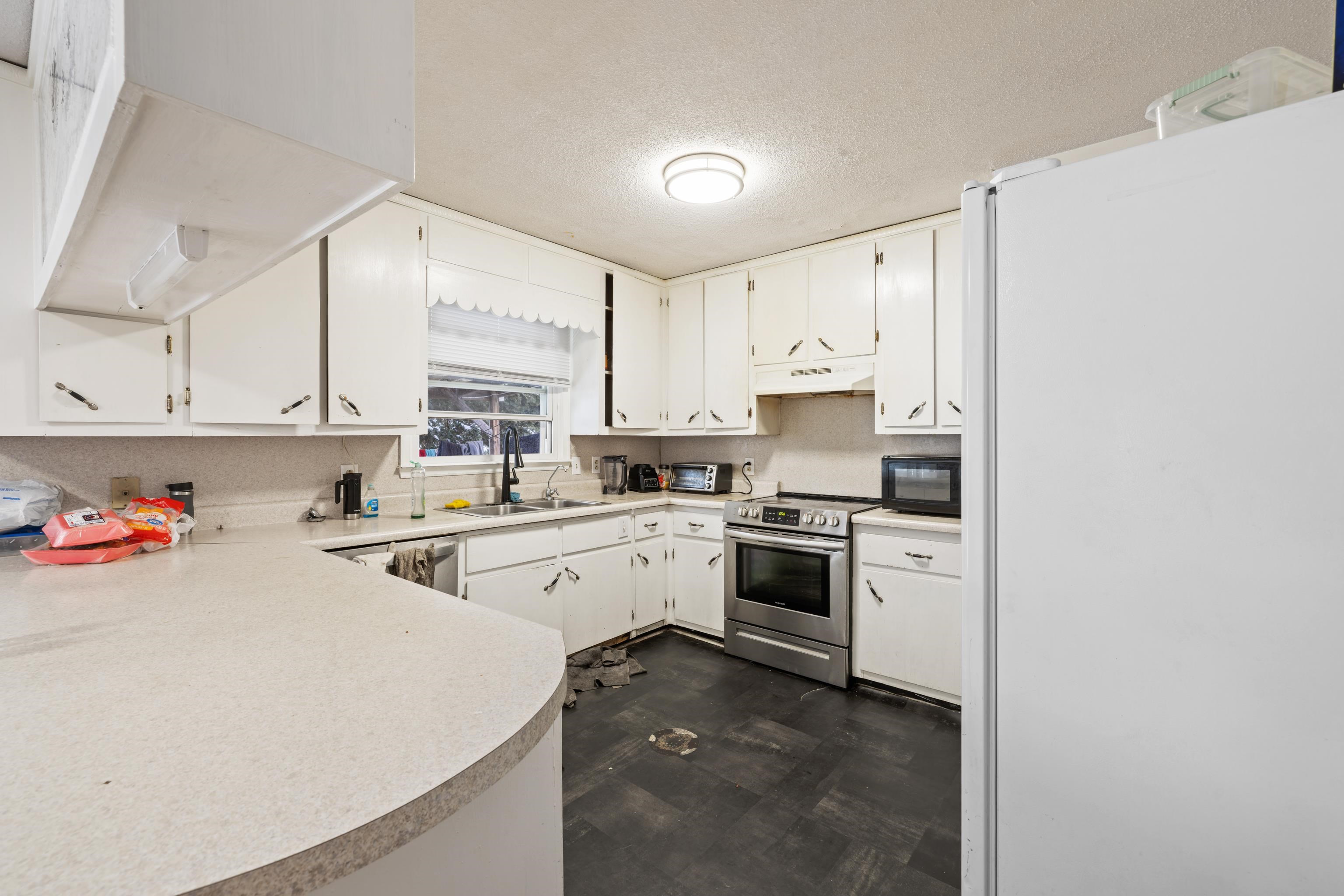 728 Foley Road Harrisonburg, VA 22801 - Photo 15 of 62 a kitchen with a sink cabinets and stainless steel appliances