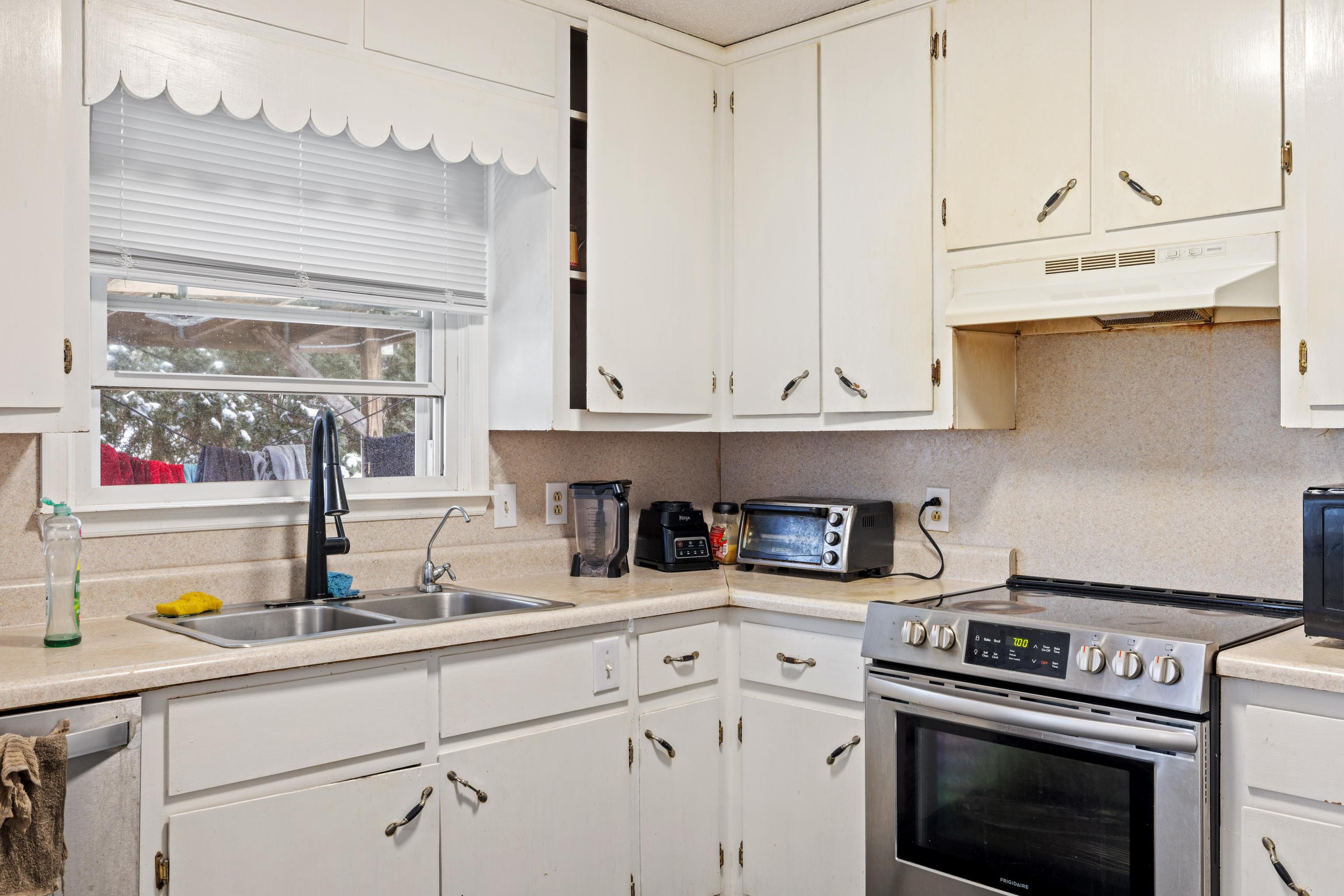 728 Foley Road Harrisonburg, VA 22801 - Photo 17 of 62 a kitchen with stainless steel appliances granite countertop a sink a stove and white cabinets