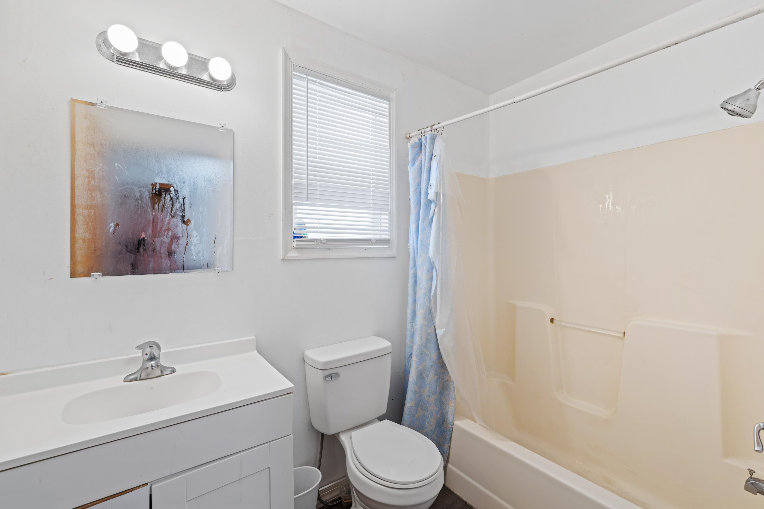 728 Foley Road Harrisonburg, VA 22801 - Photo 23 of 62 a white toilet sitting next to a bathroom sink