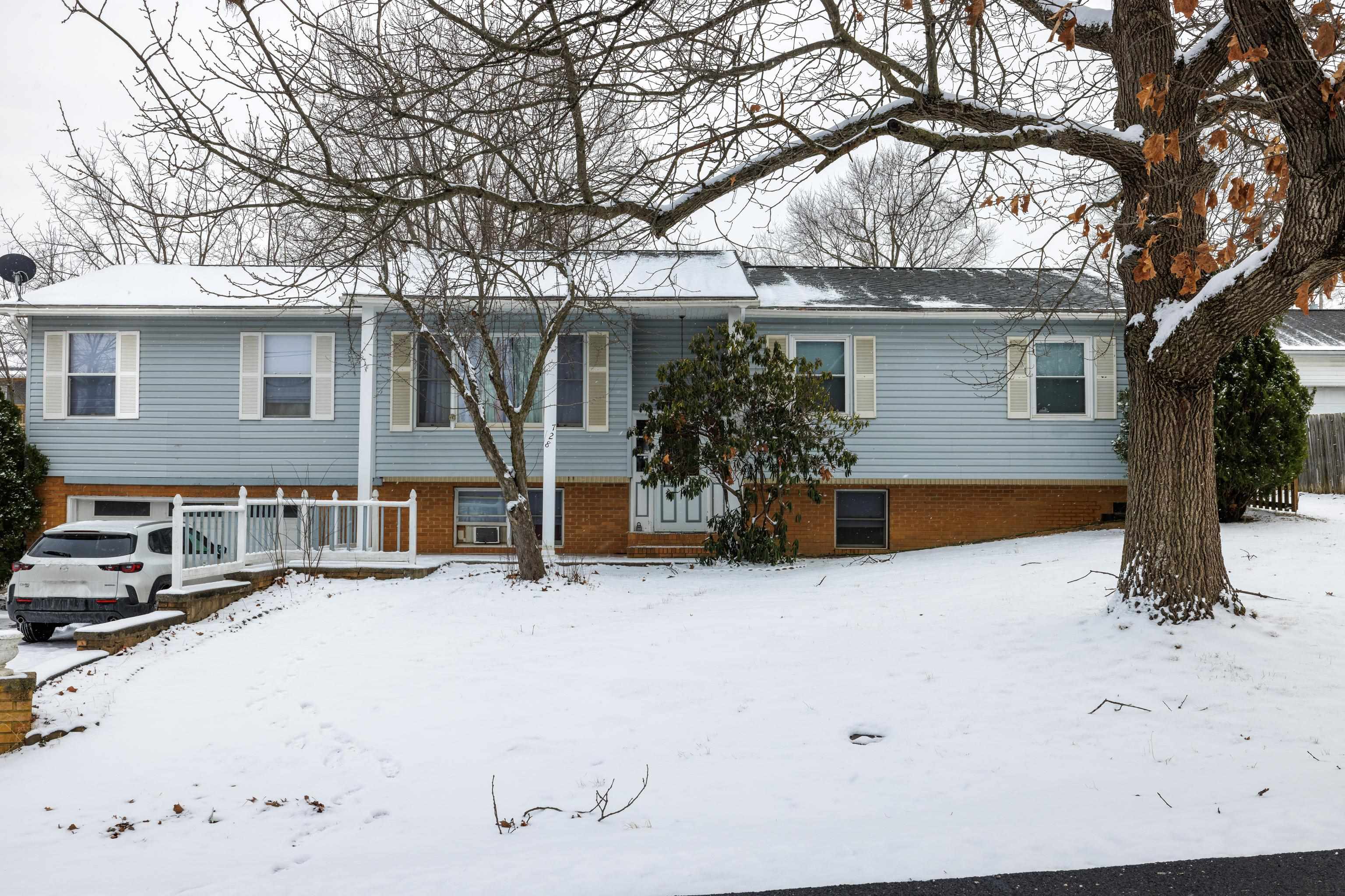 728 Foley Road Harrisonburg, VA 22801 - Photo 45 of 62 a white house that has a tree in front of it