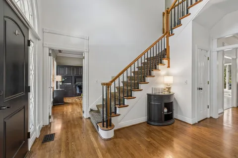 a living room with furniture rug and window