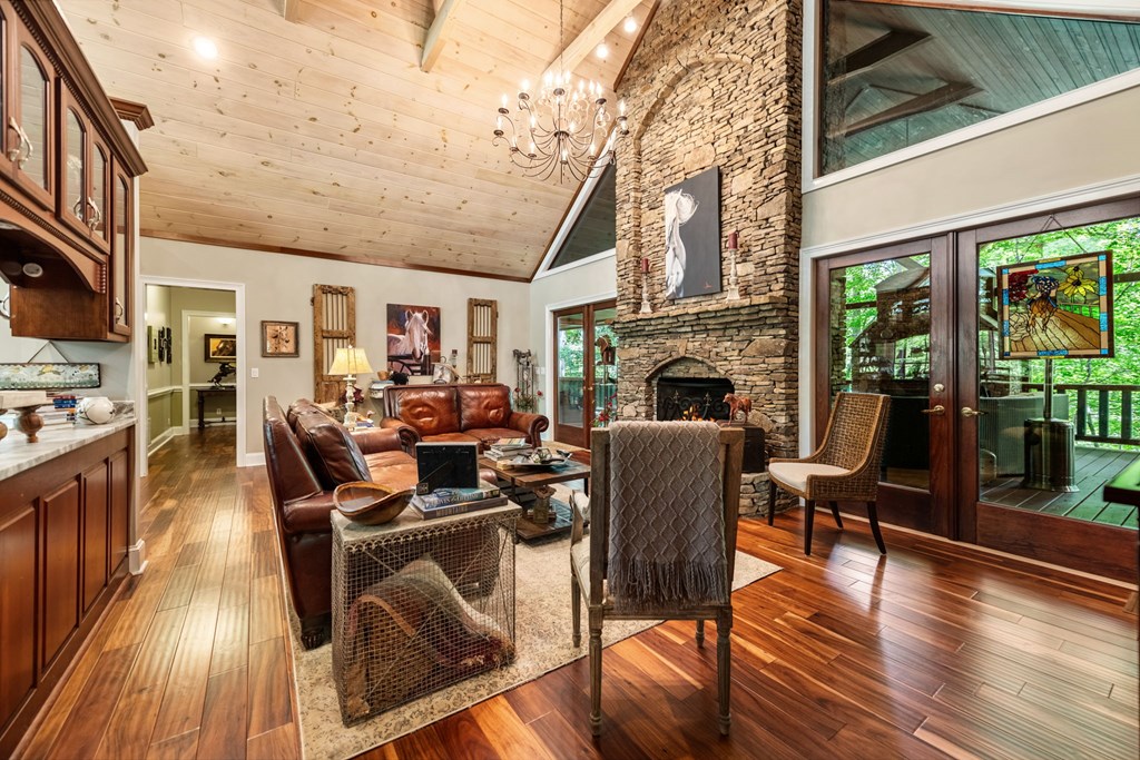 1977 Mountain Tops Road Blue Ridge, GA 30513 - Photo 22 of 52 a living room with furniture fireplace and wooden floor