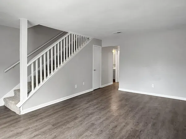 a view of an entryway with wooden floor