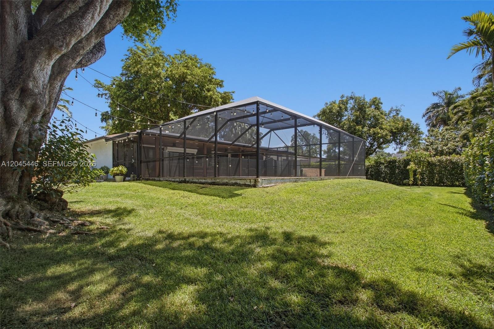 8440 Southwest 180th Street Palmetto Bay, FL 33157 - Photo 51 of 54 a view of a back yard of the house