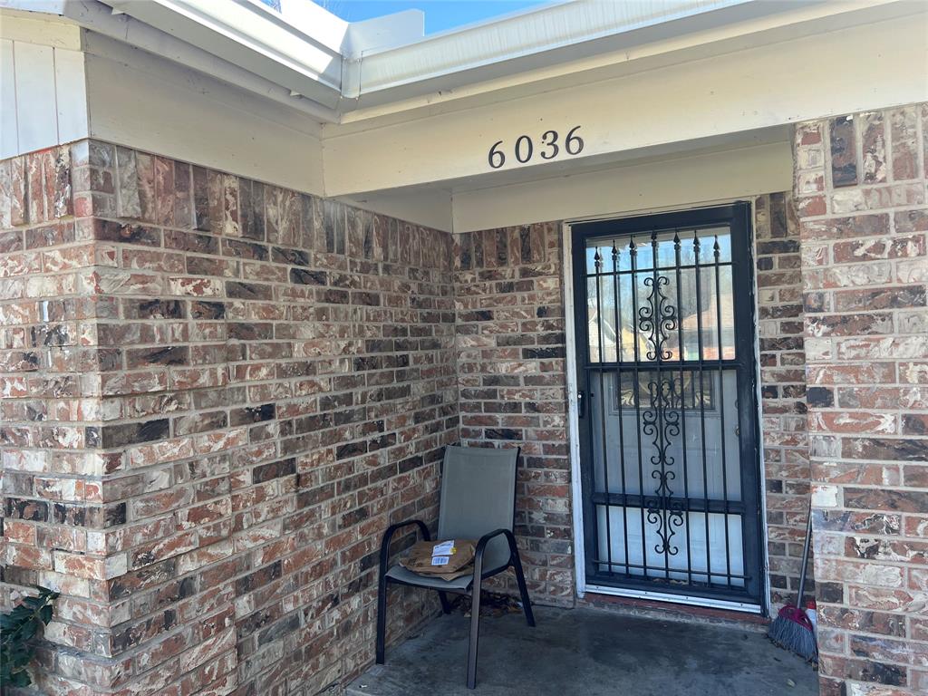 6036 Harrison Way Watauga, TX 76148 - Photo 14 of 39 Doorway to property with brick siding