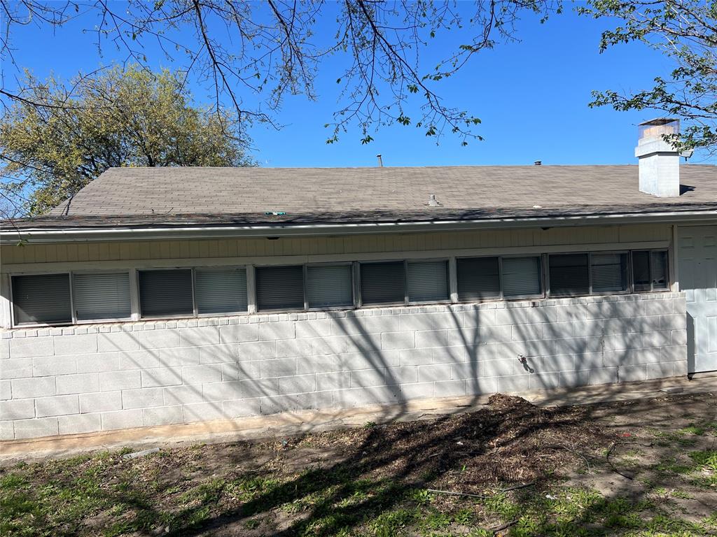 6036 Harrison Way Watauga, TX 76148 - Photo 24 of 39 Exterior view of a chimney and concrete block siding