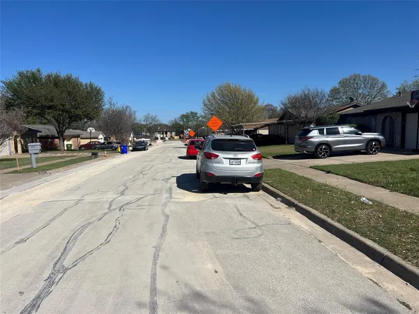 a bathroom with a granite countertop sink a toilet and bathtub