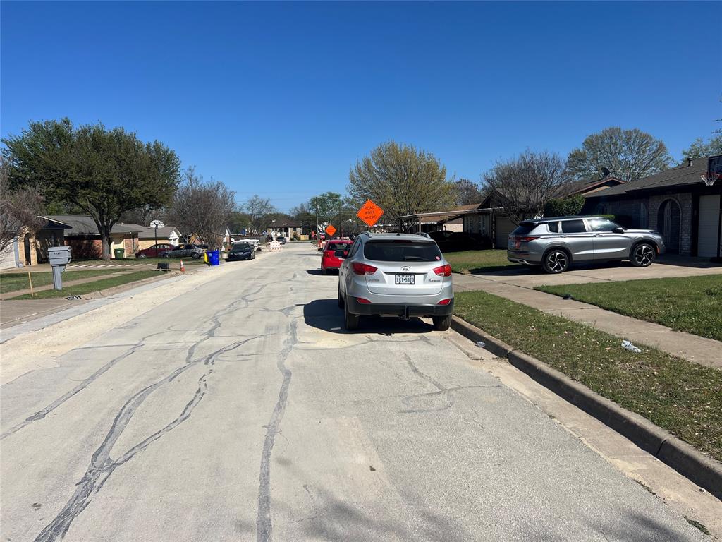 6036 Harrison Way Watauga, TX 76148 - Photo 28 of 39 View of asphalt road with sidewalks, curbs, and a residential view