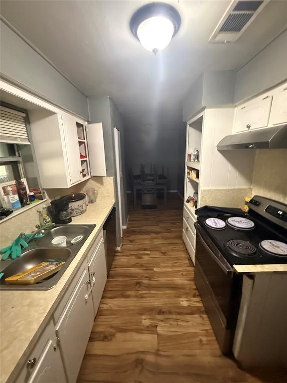 6036 Harrison Way Watauga, TX 76148 - Photo 33 of 39 Kitchen with black appliances, white cabinets, open shelves, and dark wood-type flooring