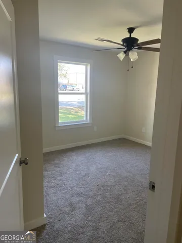 a view of a room that has a window in it