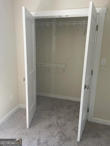 an empty room with wooden door