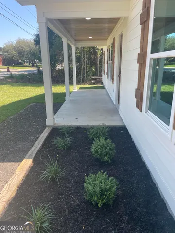 a view of a garden with an outdoor space