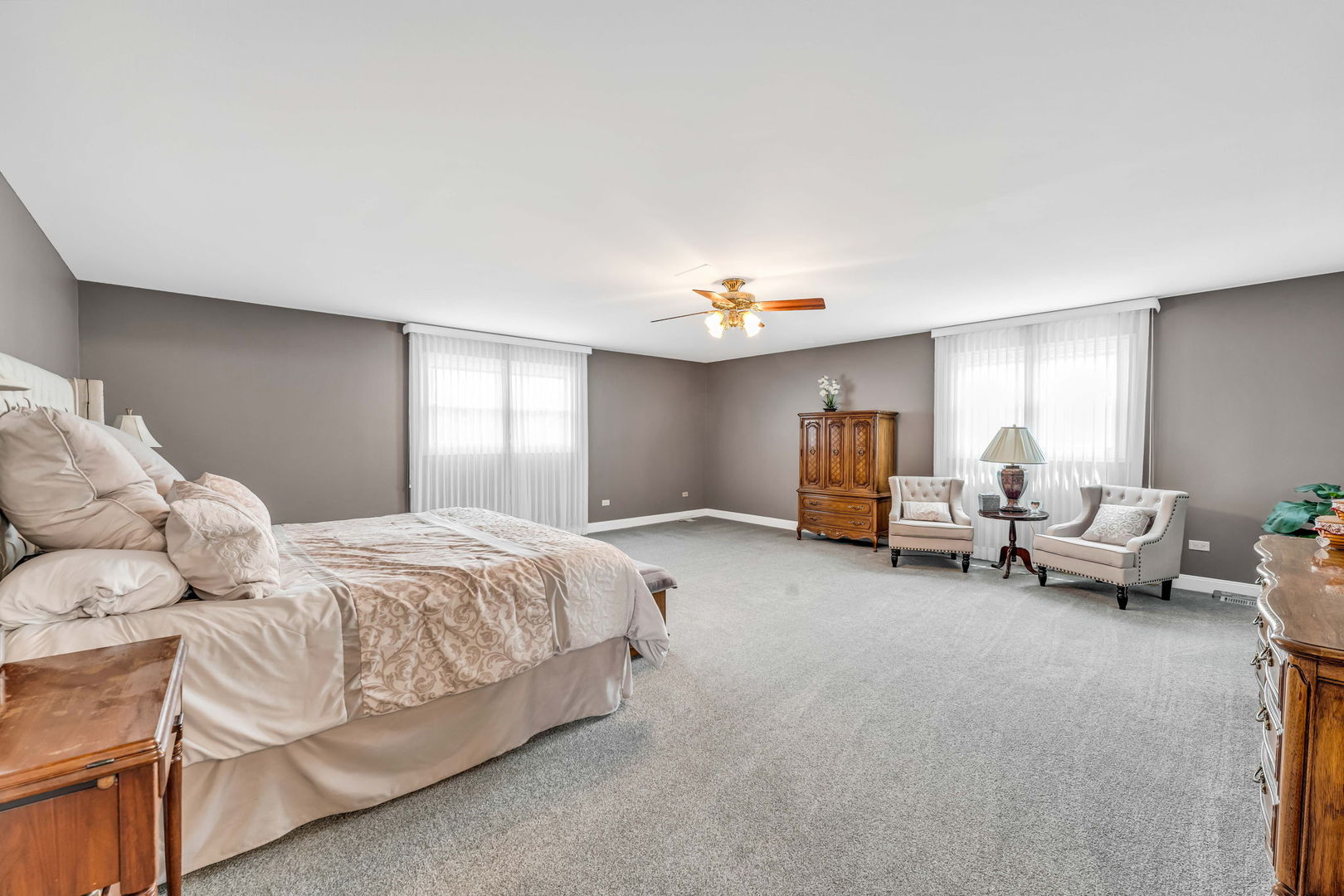 15624 Sunset Ridge Drive Orland Park, IL 60462 - Photo 20 of 37 a spacious bedroom with a bed and window