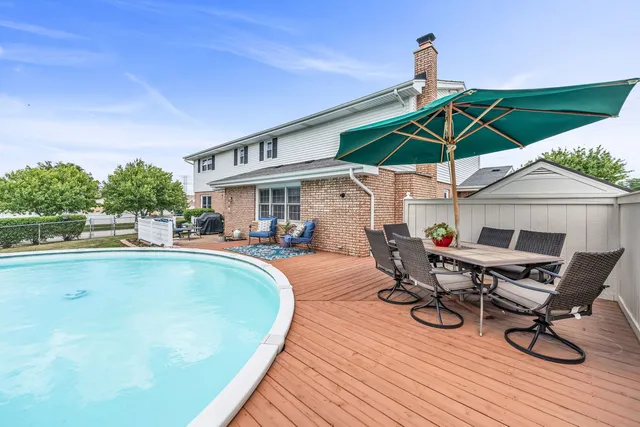 a view of a swimming pool with a patio