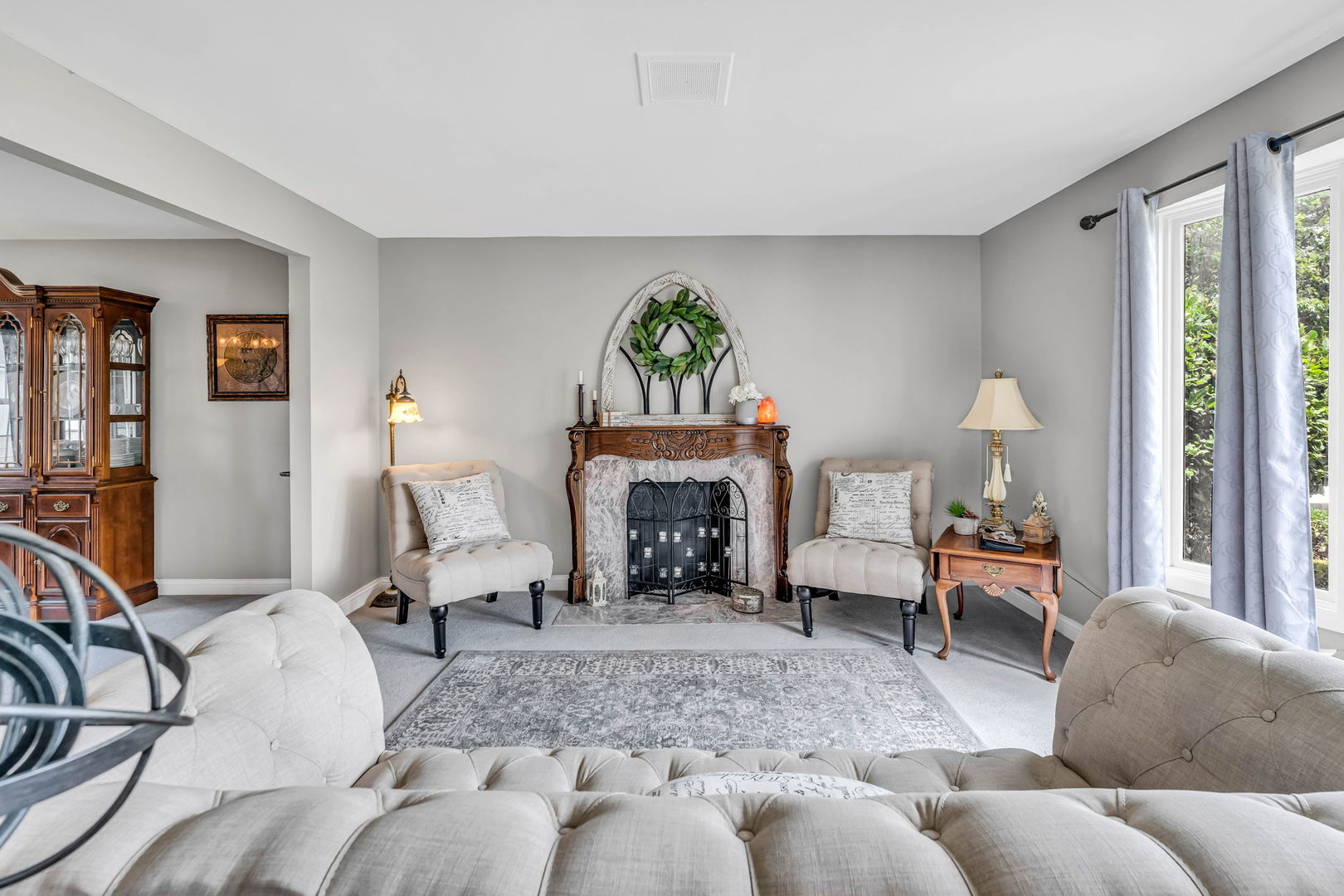15624 Sunset Ridge Drive Orland Park, IL 60462 - Photo 5 of 37 a living room with furniture and a fireplace