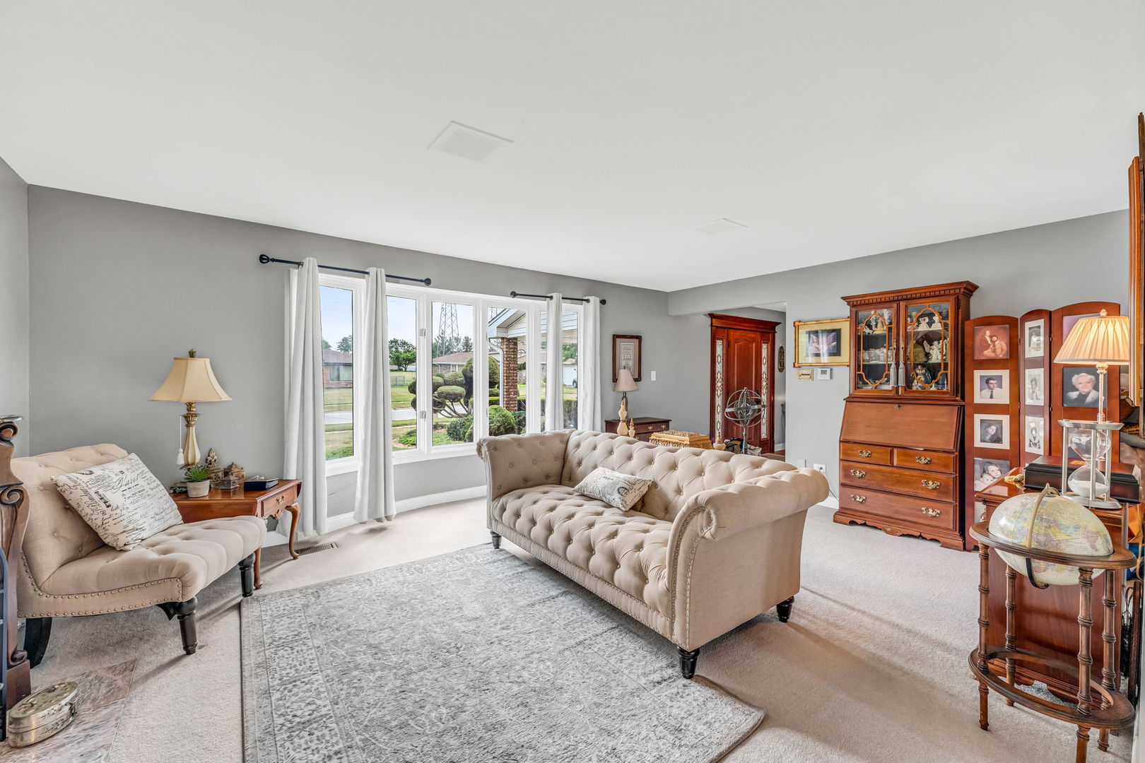 15624 Sunset Ridge Drive Orland Park, IL 60462 - Photo 6 of 37 a living room with furniture and a large window