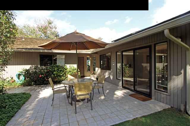 1365 Lower Kula Road Kula, HI 96790 - Photo 11 of 30 a view of a patio with table and chairs under an umbrella
