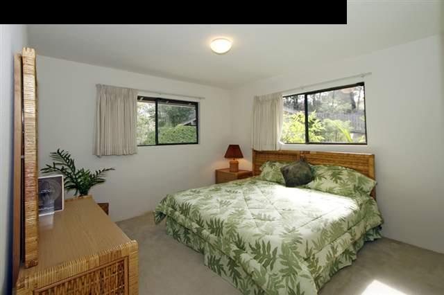 1365 Lower Kula Road Kula, HI 96790 - Photo 21 of 30 a bedroom with a bed and a window