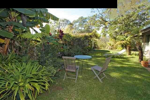 1365 Lower Kula Road Kula, HI 96790 - Photo 29 of 30 a table and chairs in a garden