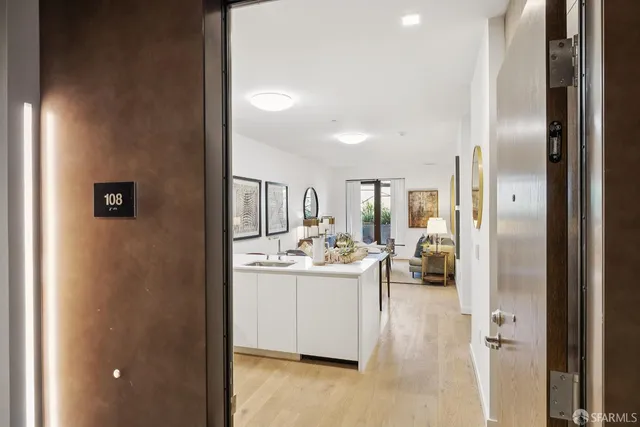 a very nice looking room with a big room and wooden floor