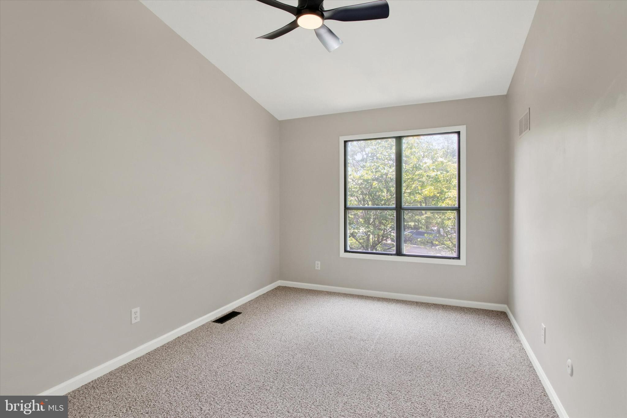 33 Pinehurst Court Reading, PA 19607 - Photo 13 of 30 an empty room with a window and a ceiling fan