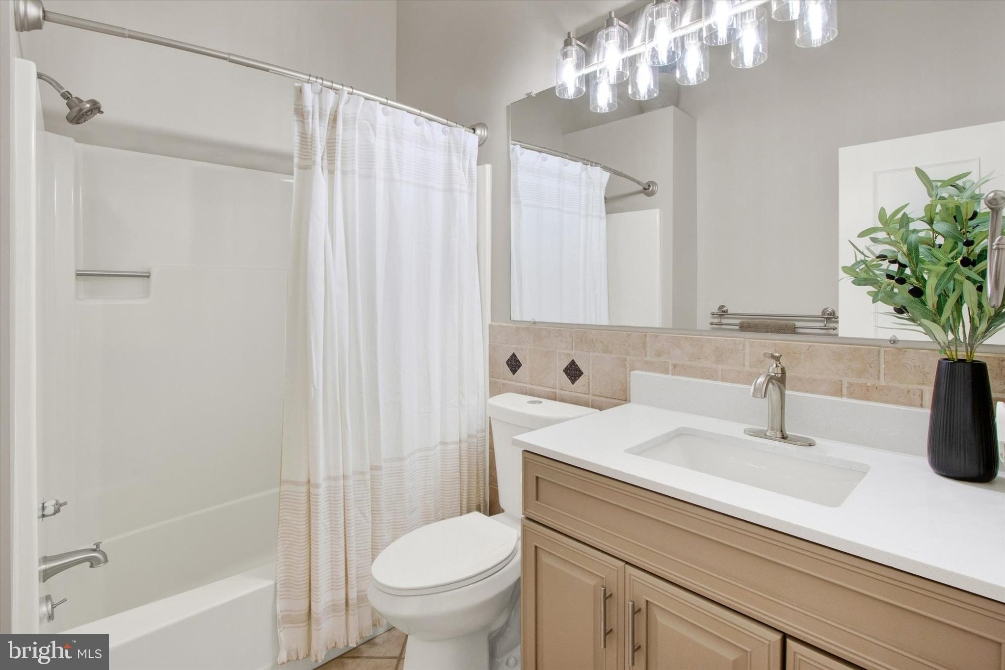 33 Pinehurst Court Reading, PA 19607 - Photo 15 of 30 a bathroom with a sink a toilet and shower