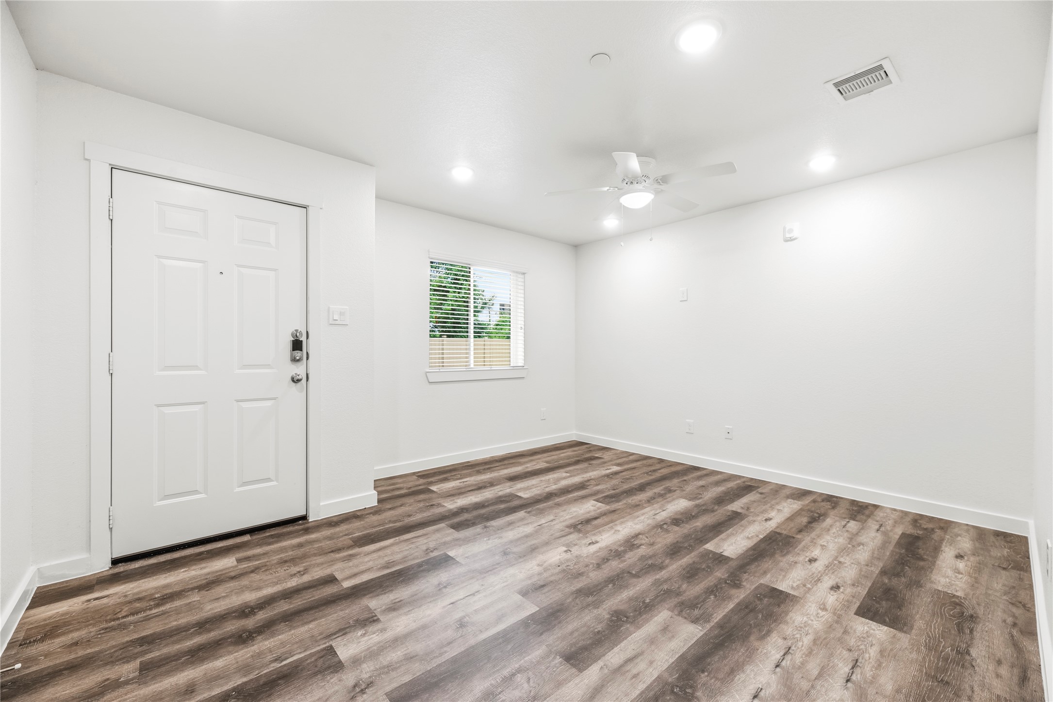 12603 Telge Road, Unit 1EH Cypress, TX 77429 - Photo 3 of 19 The family room is spacious and has a ceiling fan.