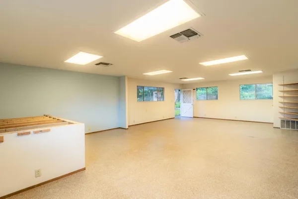 a view of an empty room with a window