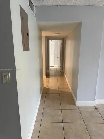 a view of hallway with a front door