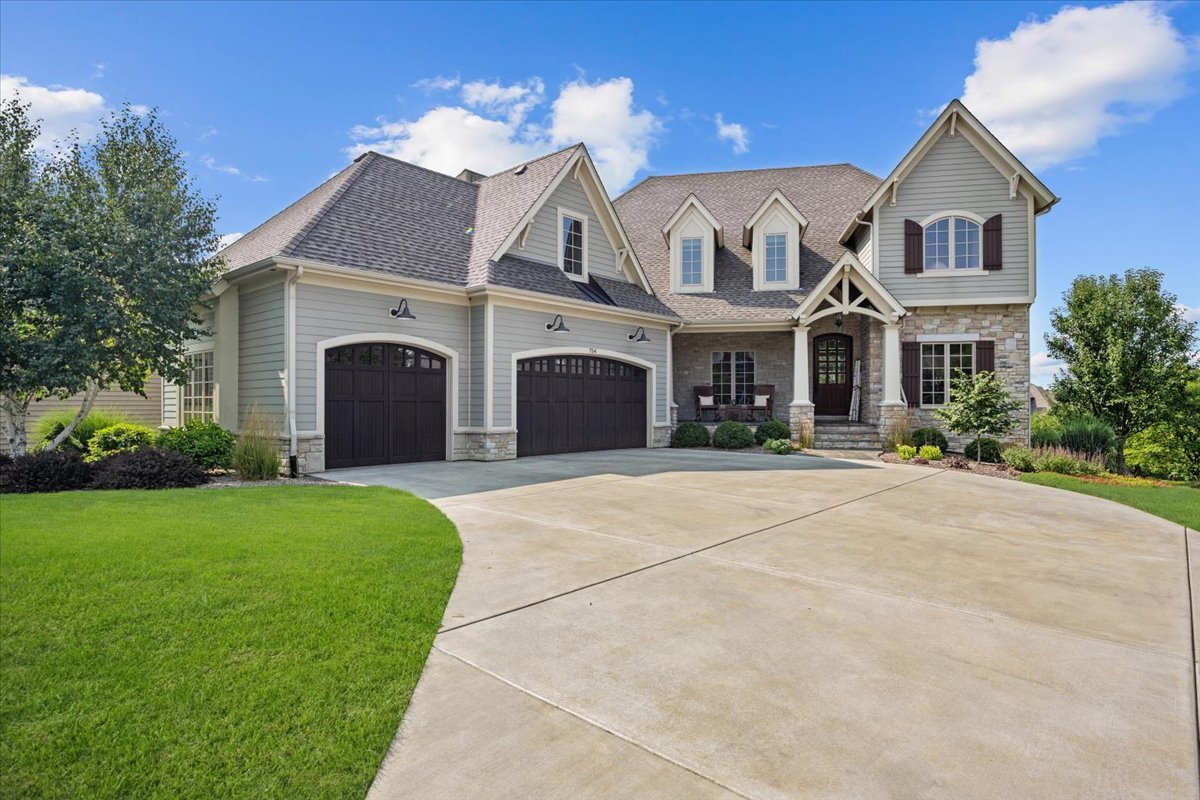 754 Wild Ginger Road Sugar Grove, IL 60554 - Photo 1 of 52 a front view of a house with a yard and garage