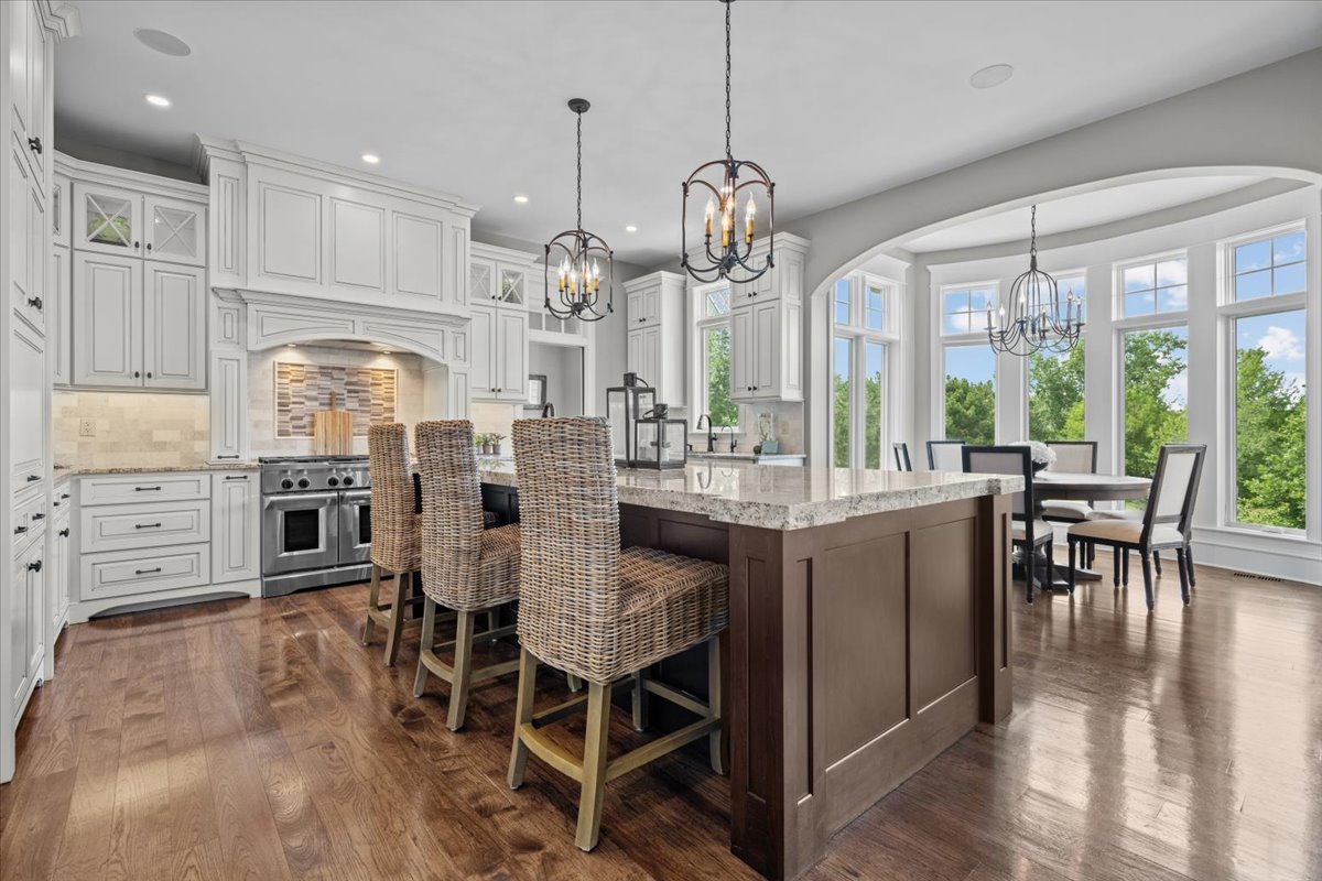 754 Wild Ginger Road Sugar Grove, IL 60554 - Photo 12 of 52 a large kitchen with a table and chairs