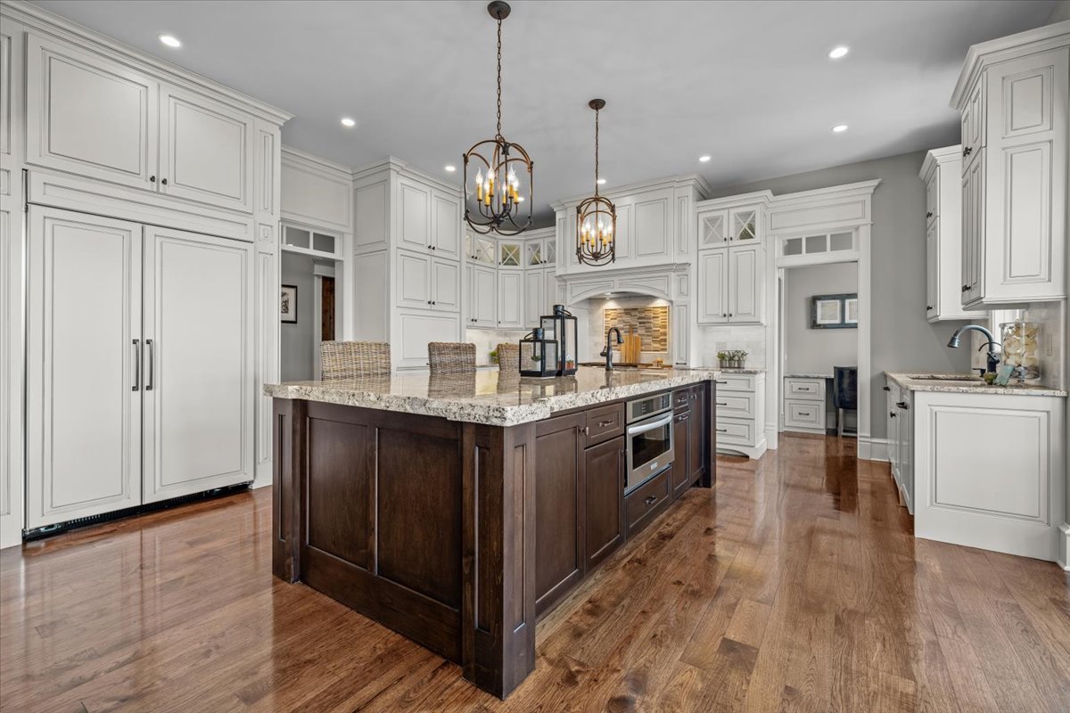754 Wild Ginger Road Sugar Grove, IL 60554 - Photo 13 of 52 a large kitchen with stainless steel appliances granite countertop a large stove a sink dishwasher and a refrigerator with wooden floor