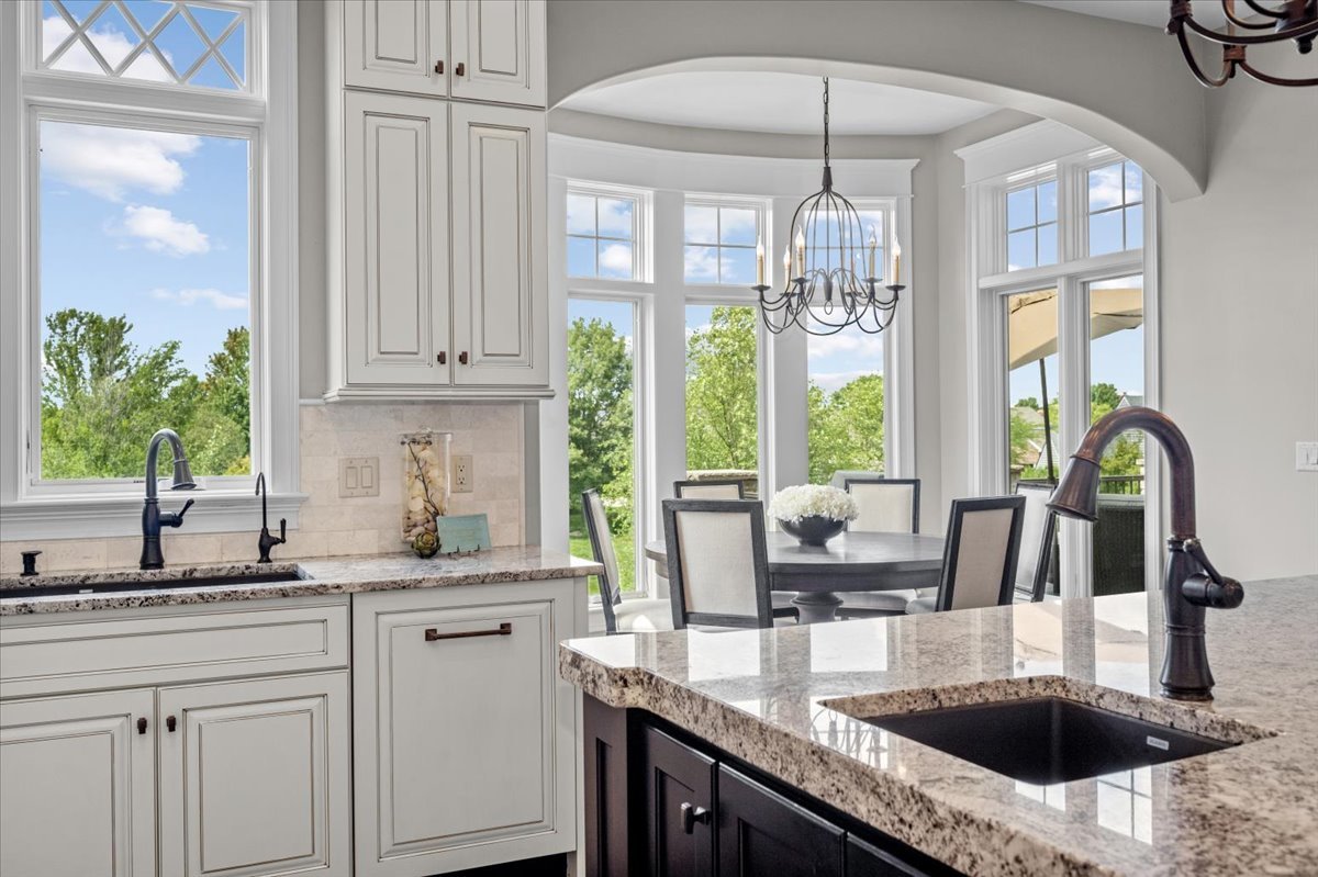 754 Wild Ginger Road Sugar Grove, IL 60554 - Photo 16 of 52 a kitchen with granite countertop a sink and a window